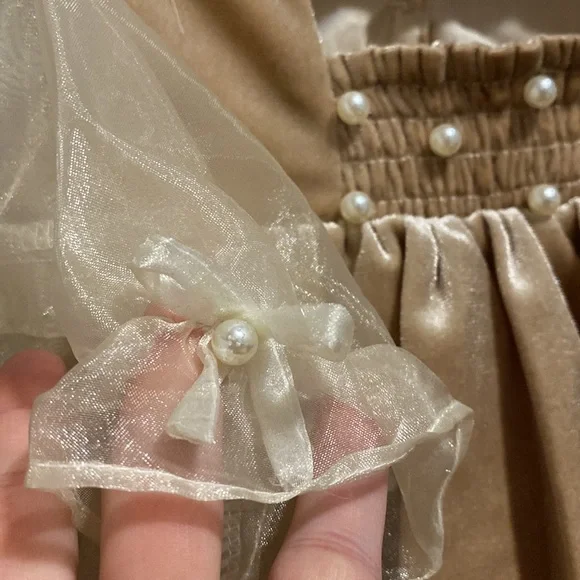 It’s not from Petit Maison Kids, romper 12-18 months.